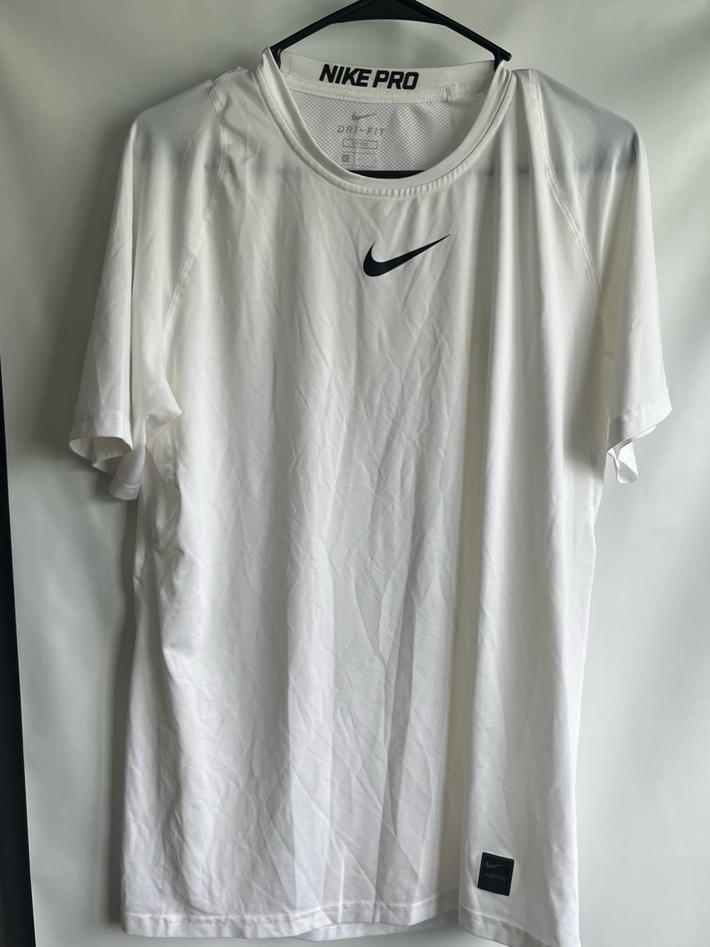 Nike White Short Sleeve Dri-FIT Training Tee with Black Swoosh